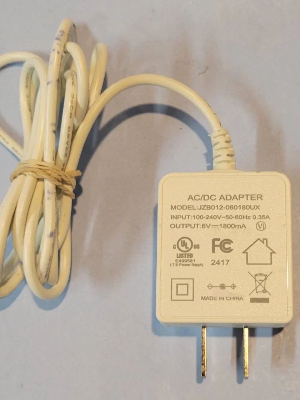 AC/DC Adapter Model JZB012-060180UX 6V 1800mA